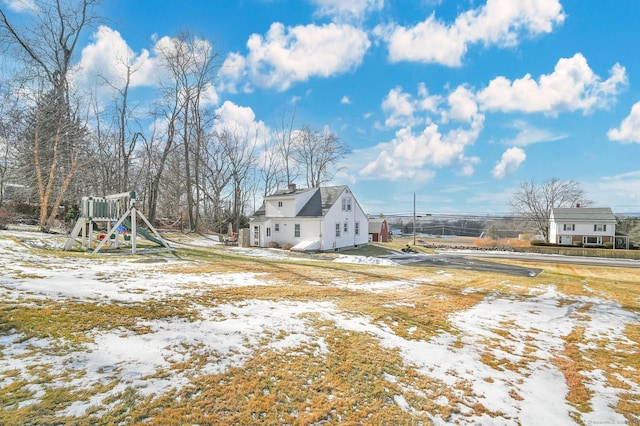 snowy yard with a playground