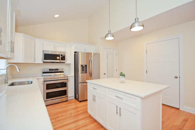 kitchen featuring sink, stainless steel appliances, and white cabinets