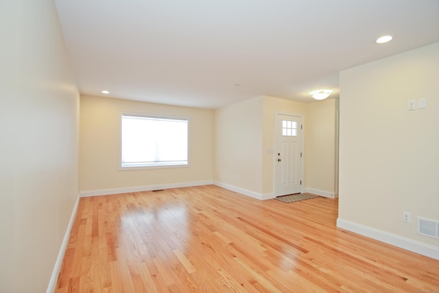 unfurnished room with light hardwood / wood-style floors