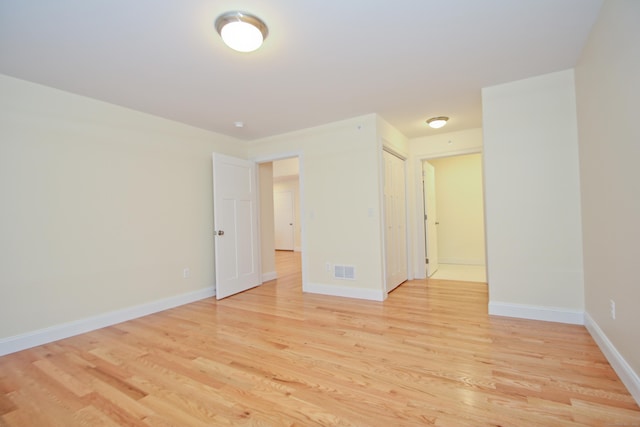 unfurnished room with light hardwood / wood-style floors