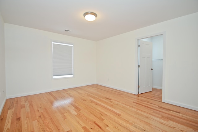 unfurnished room featuring light wood-type flooring