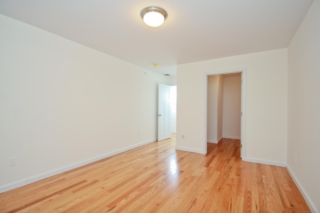 empty room with light hardwood / wood-style floors