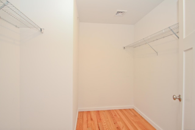 spacious closet with wood-type flooring