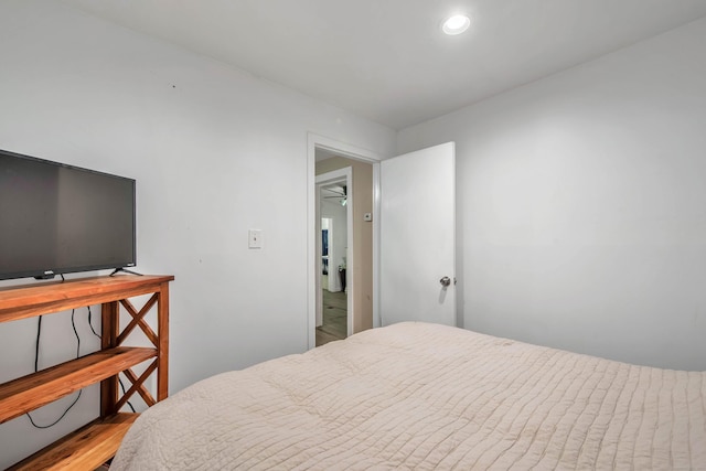 bedroom with light wood finished floors and recessed lighting