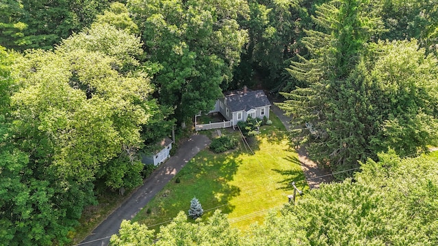 drone / aerial view featuring a view of trees