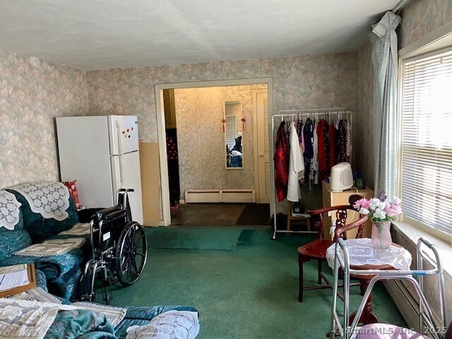 miscellaneous room featuring a baseboard radiator and carpet