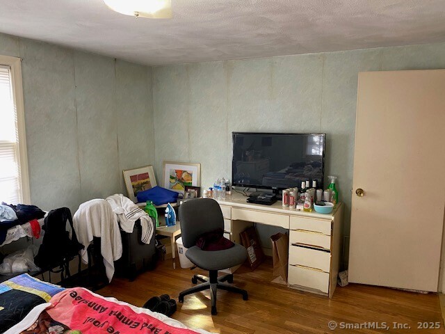 office area with hardwood / wood-style flooring