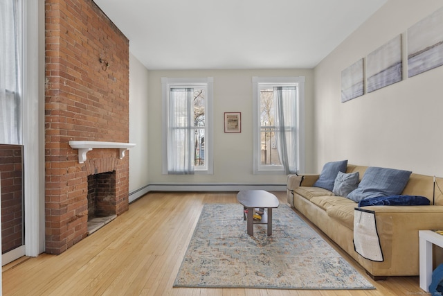 living room with a fireplace and light hardwood / wood-style floors