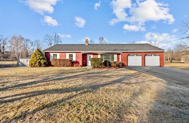 single story home with a garage and a front yard