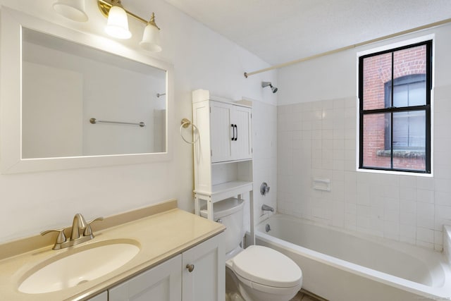 full bathroom with vanity, toilet, and tiled shower / bath