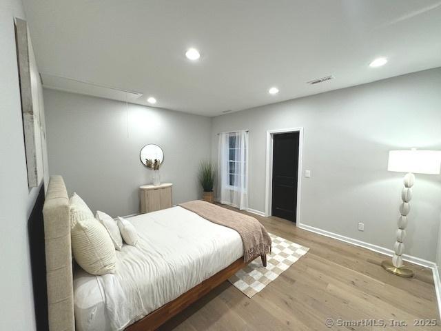 bedroom featuring light wood-type flooring