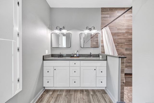 bathroom featuring vanity, wood-type flooring, and a shower with curtain