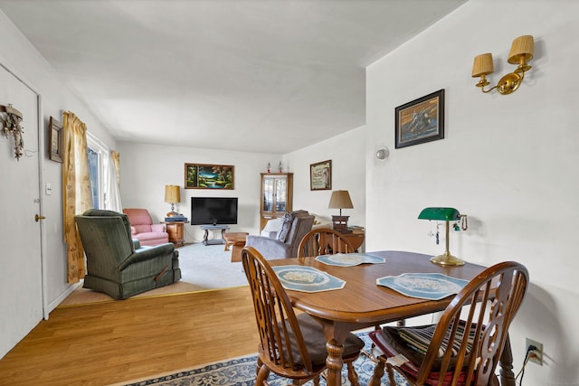 dining space featuring light wood-style floors