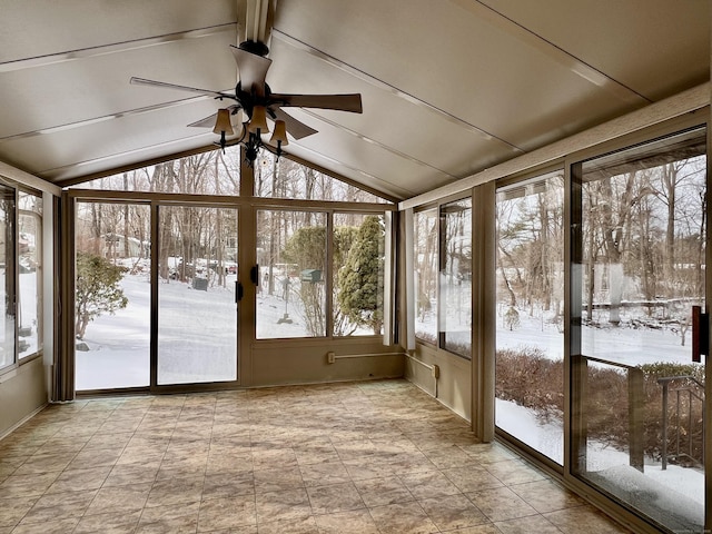 unfurnished sunroom with vaulted ceiling and ceiling fan