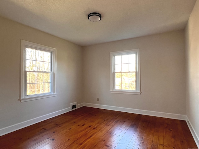 empty room featuring dark hardwood / wood-style floors