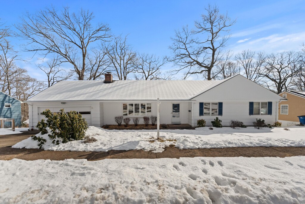 ranch-style home with a garage