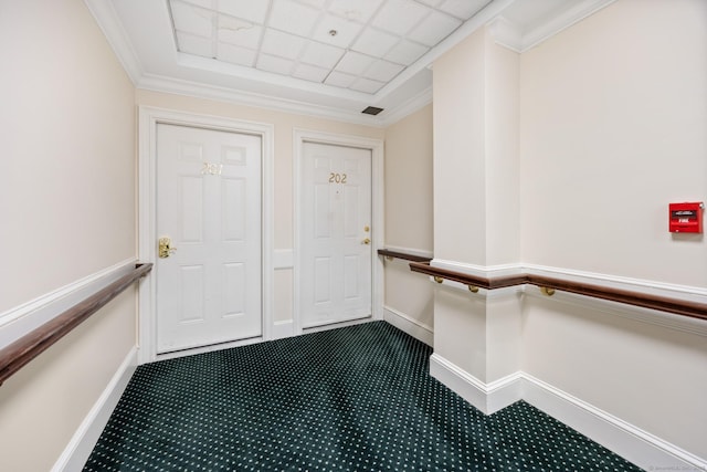 interior space with carpet floors and a paneled ceiling