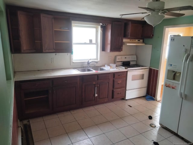 kitchen with dark brown cabinetry, sink, white appliances, light tile patterned floors, and ceiling fan