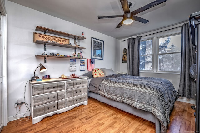 bedroom featuring ceiling fan and light wood-type flooring