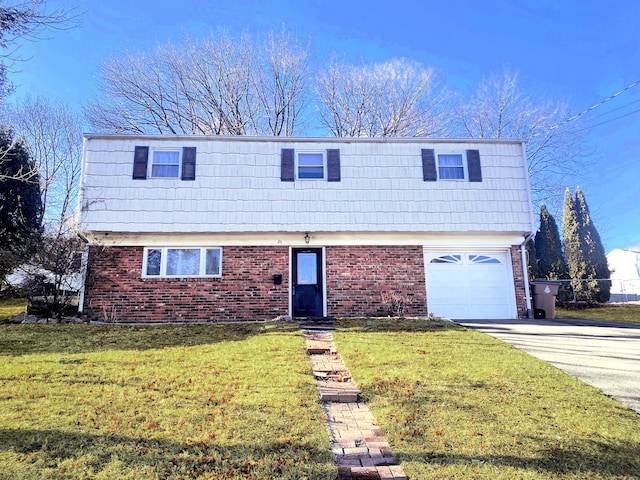 view of front property featuring a garage and a front yard