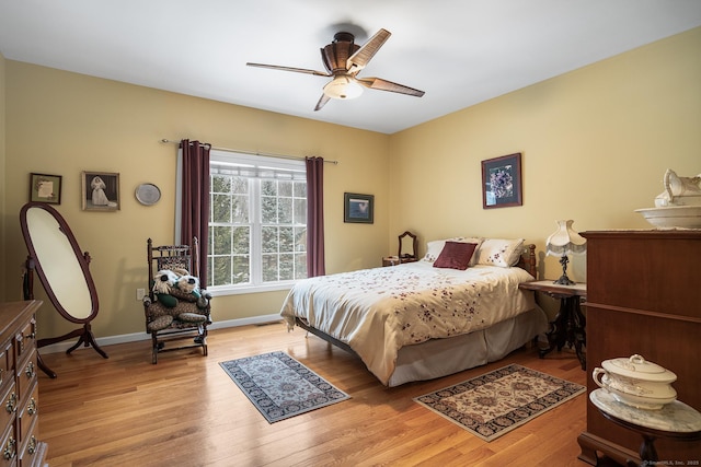 bedroom featuring ceiling fan and light hardwood / wood-style flooring