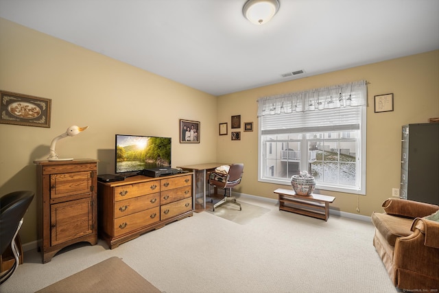 interior space featuring light carpet