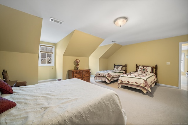 carpeted bedroom featuring lofted ceiling