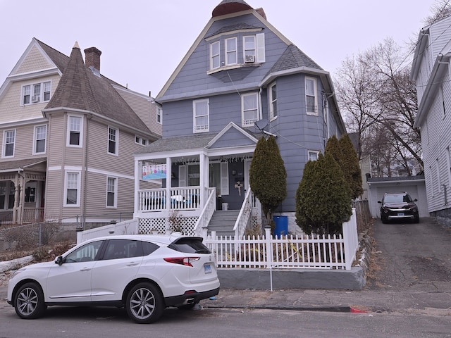 victorian house featuring a porch