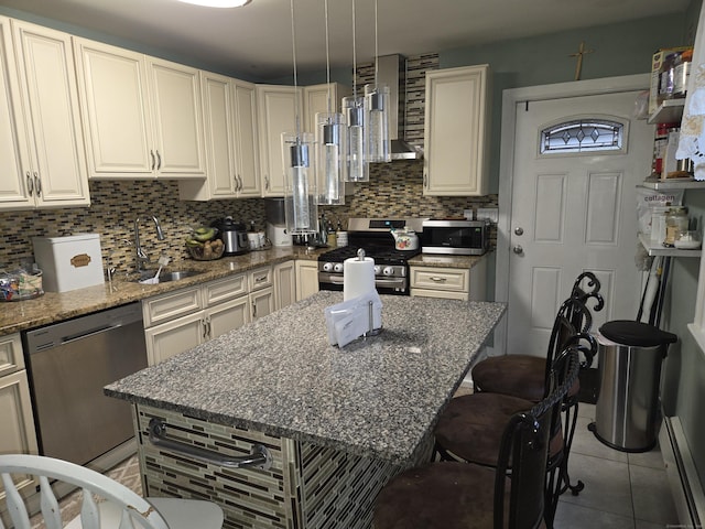 232 Hillside Ave, Waterbury, CT 06710 - kitchen with stainless steel appliances, a sink, wall chimney exhaust hood, a baseboard heating unit, and decorative backsplash