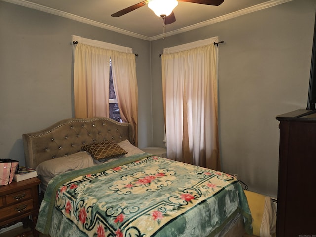 bedroom featuring ornamental molding and ceiling fan