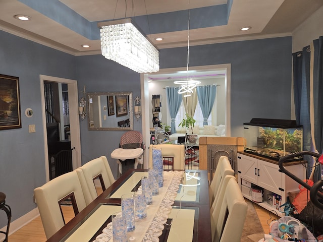 232 Hillside Ave, Waterbury, CT 06710 - dining space featuring a chandelier, ornamental molding, recessed lighting, wood finished floors, and baseboards