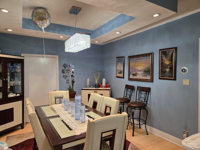 232 Hillside Ave, Waterbury, CT 06710 - dining room featuring wood finished floors, a tray ceiling, recessed lighting, baseboards, and a chandelier