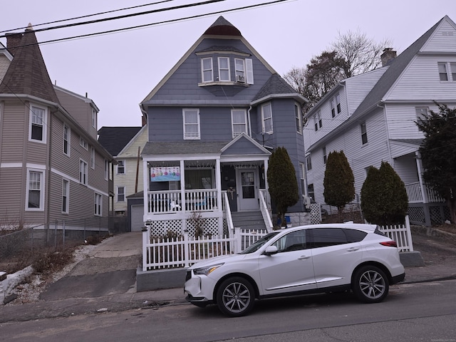 victorian-style house featuring a porch