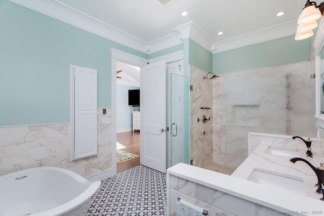 464 Park Blvd, Stratford, CT 06615 - bathroom with ornamental molding, a freestanding bath, a tile shower, and a sink