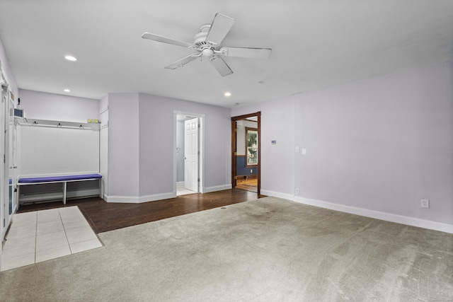 unfurnished bedroom with ceiling fan and carpet floors