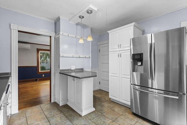 kitchen featuring crown molding, white cabinetry, stainless steel refrigerator with ice dispenser, a wall mounted air conditioner, and decorative light fixtures