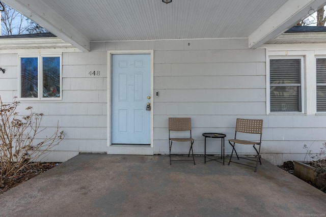 property entrance featuring a patio area