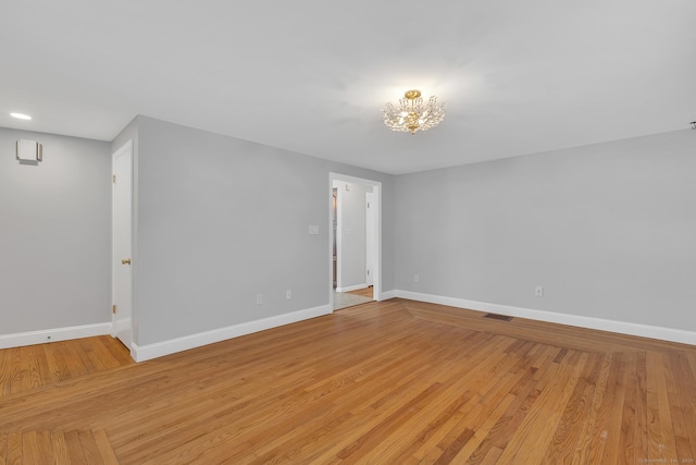 spare room with light wood-type flooring