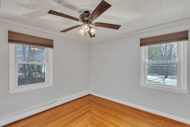 empty room featuring ceiling fan, a baseboard radiator, and ornamental molding