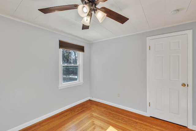 unfurnished room featuring ornamental molding, hardwood / wood-style floors, and ceiling fan