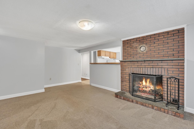 unfurnished living room with a brick fireplace, carpet, and a textured ceiling