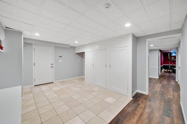 basement featuring light wood-type flooring