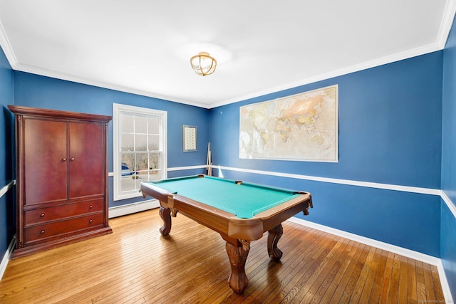 playroom featuring pool table, ornamental molding, a baseboard radiator, and light hardwood / wood-style floors