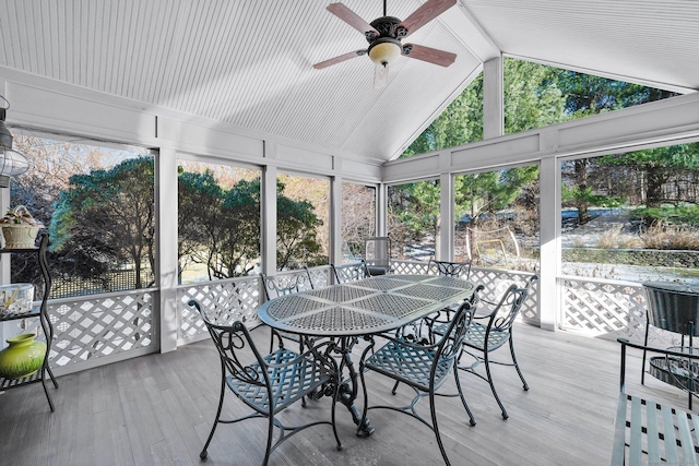 sunroom featuring lofted ceiling with beams and ceiling fan