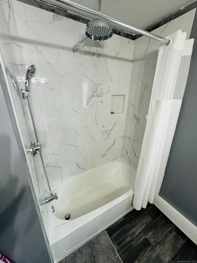 bathroom with shower / tub combo with curtain