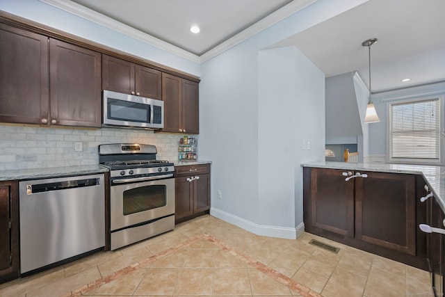 kitchen with tasteful backsplash, crown molding, hanging light fixtures, stainless steel appliances, and light stone countertops