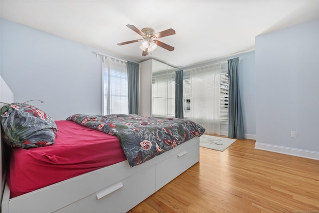 bedroom featuring ceiling fan and light hardwood / wood-style floors