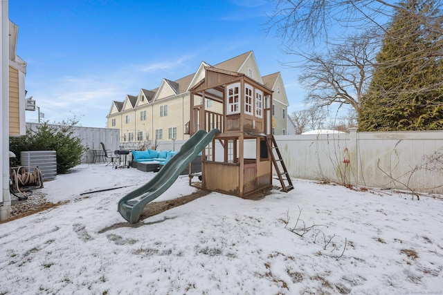 snow covered playground with central AC unit