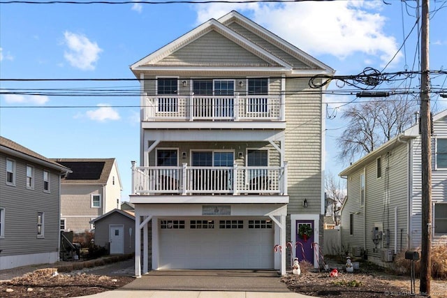 view of front of home featuring a garage and a balcony