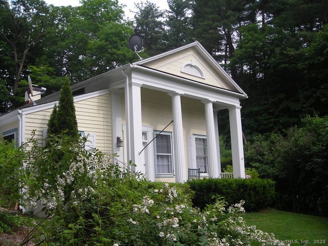 view of outdoor structure featuring covered porch